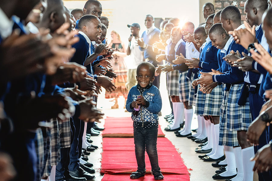 Boy standing on red carpet. Night to Shine event